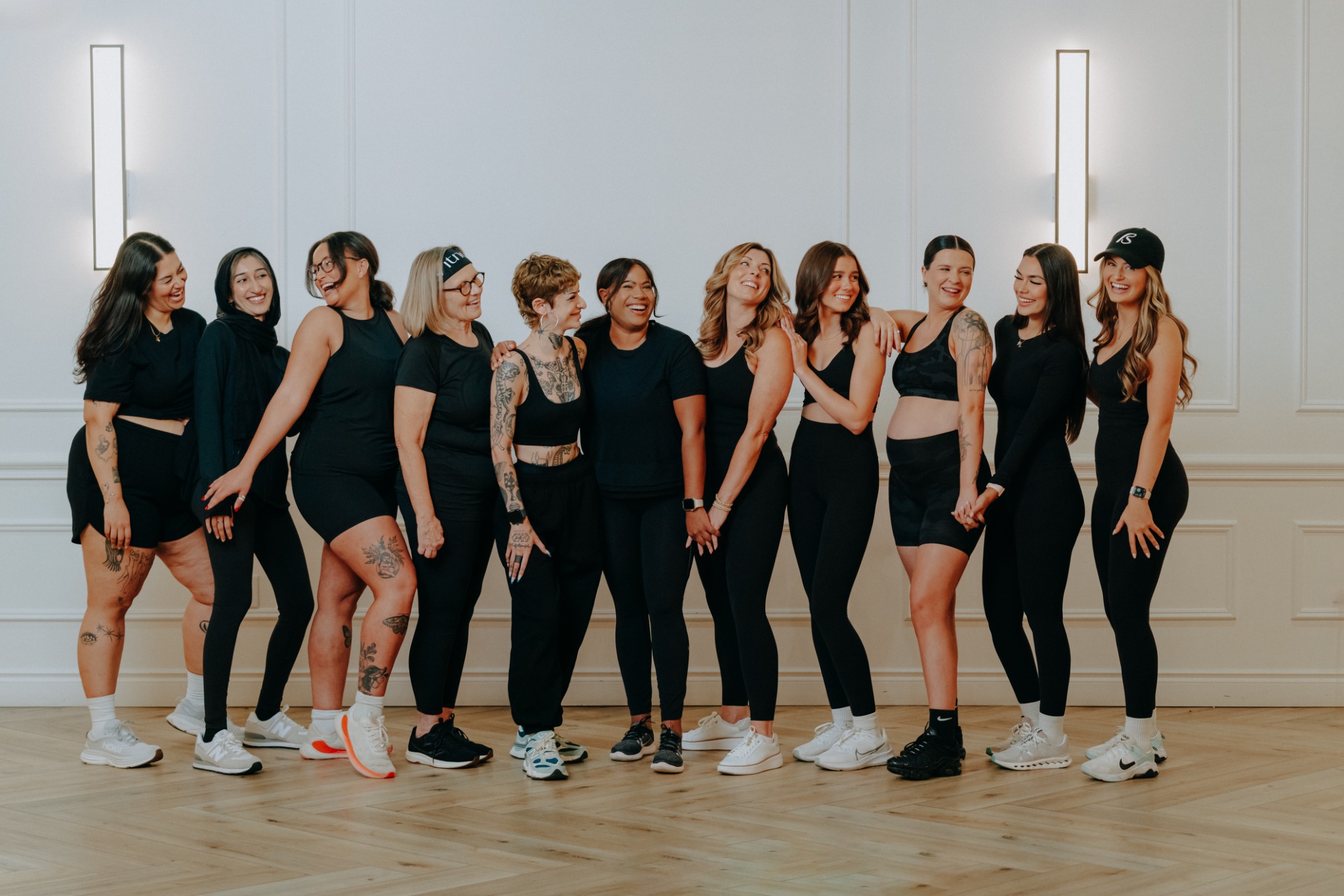 BFITNESS women together smiling at a group photoshoot