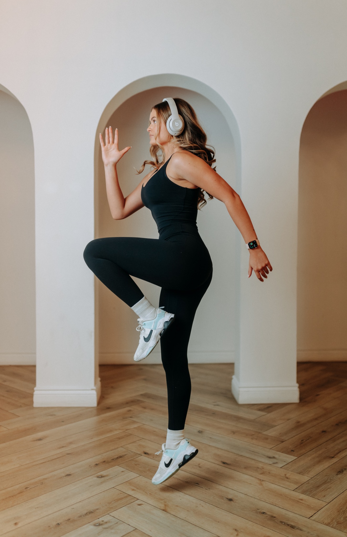 BFITNESS member in motion wearing headphones
